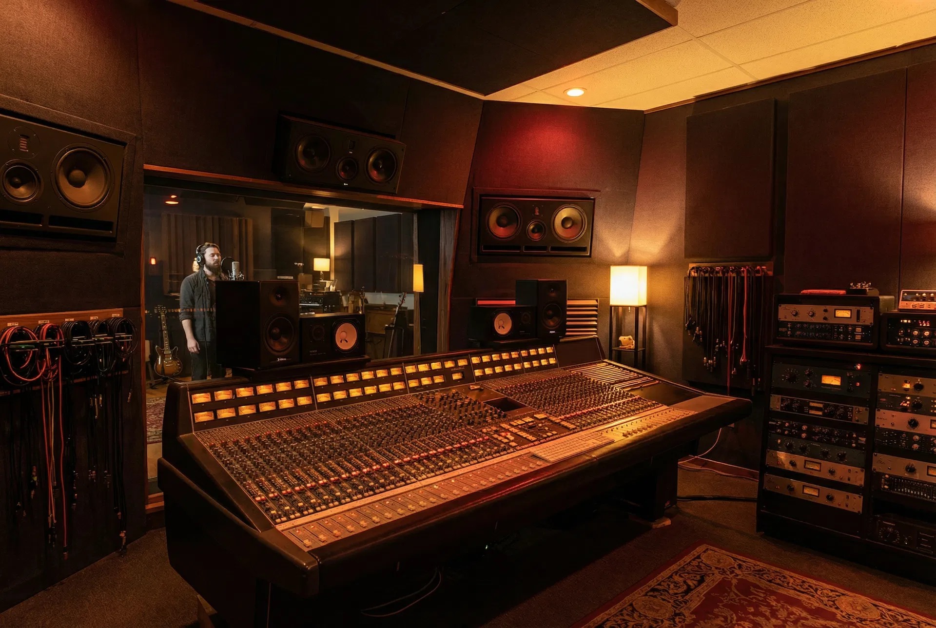 Tracking session at the SSL console with vocalist in the live room