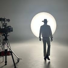 Cowboy silhouette against a single backlight on the cyc