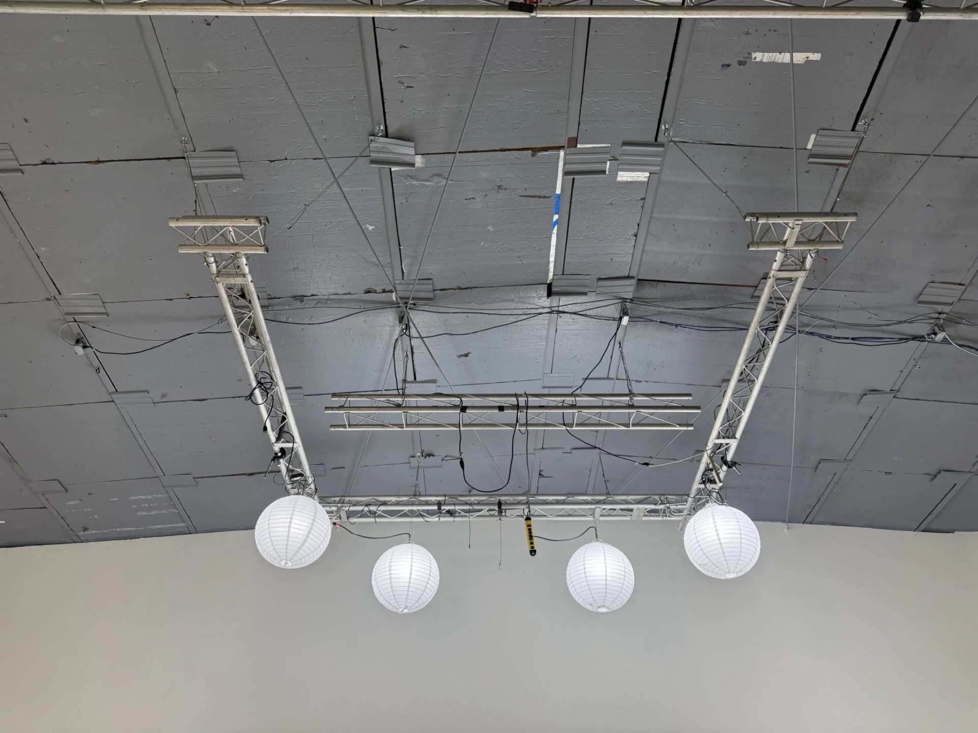 Overhead truss with china balls rigged for a dance shoot